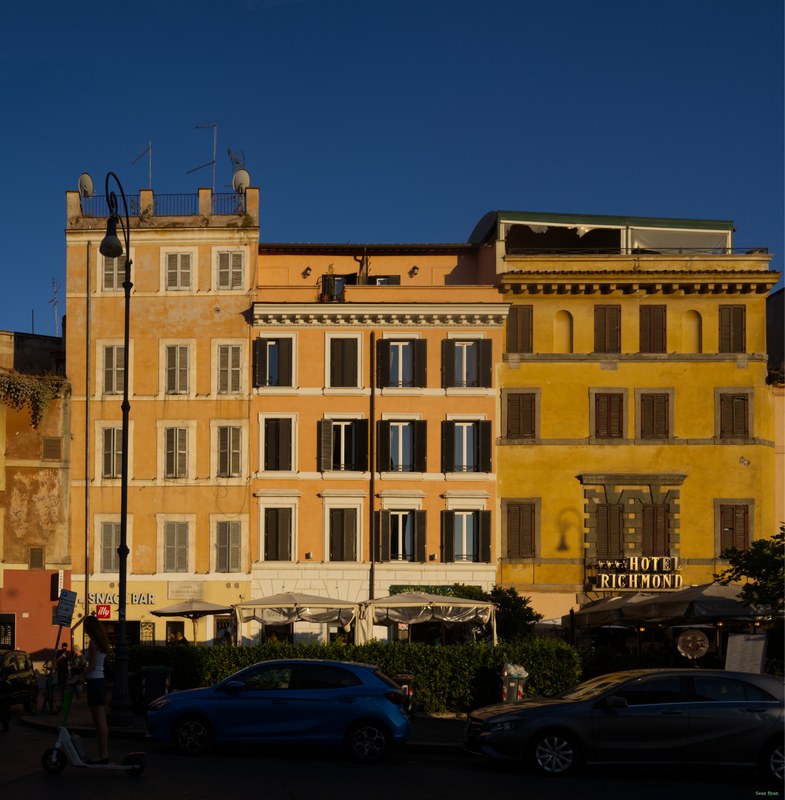Roman restaurants aglow in summer sun.